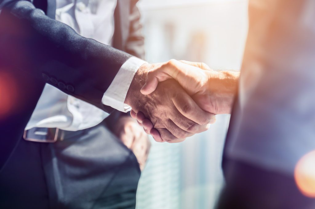 Partners Shaking Hands - Prestige Gaming Solutions